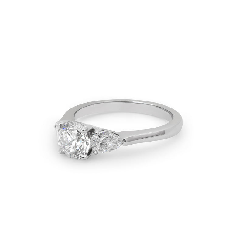 Round Solitaire Ring with Pear Shaped Diamonds