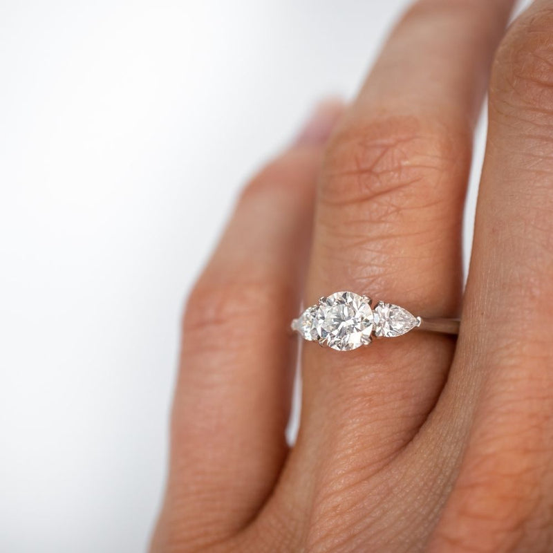 Round Solitaire Ring with Pear Shaped Diamonds